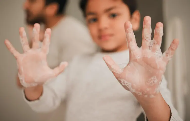 child-hands-soap-cleaning-hygiene-grooming-safety-from-bacteria-with-closeup-home-health-wellness-protection-foam-palm-with-young-person-learn-handwashing-skincare-min